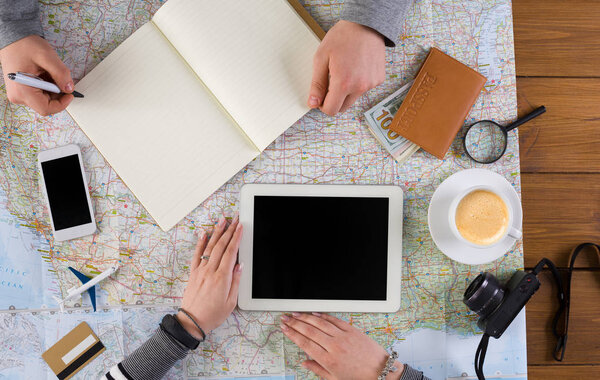 Couple planning vacation, search and notes