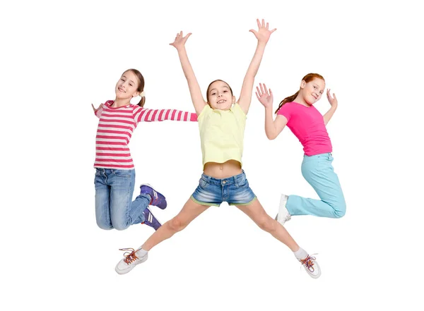 Niños felices saltando en el estudio, espacio para copiar —  Fotos de Stock