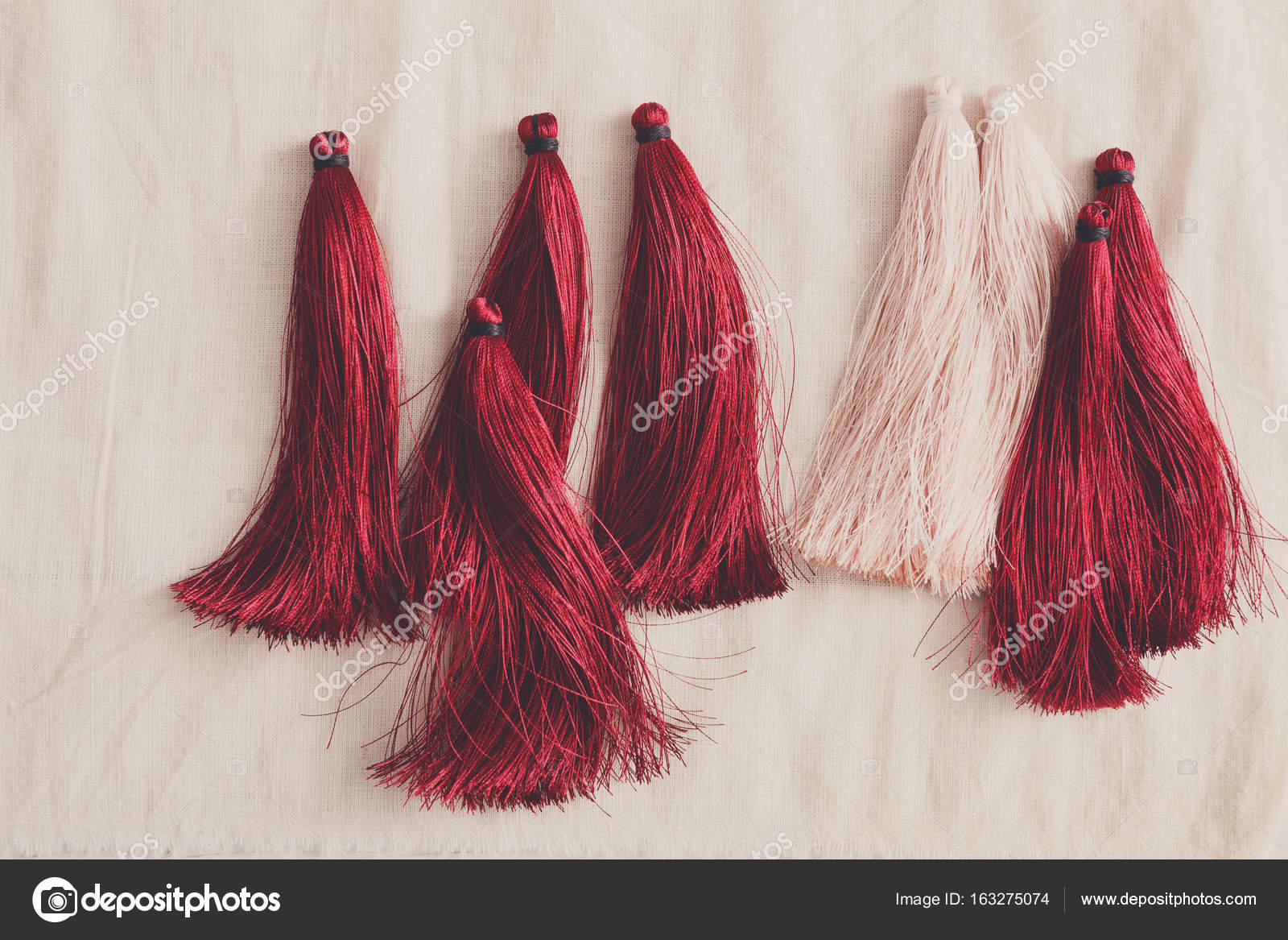 Red and white tassels line close up Stock Photo by ©Milkos 163275074