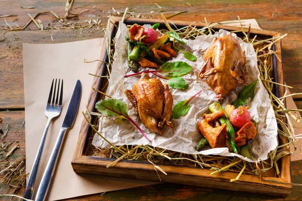 Modern restaurant food. Quails baked with asparagus and chanterelles — Stock Photo, Image