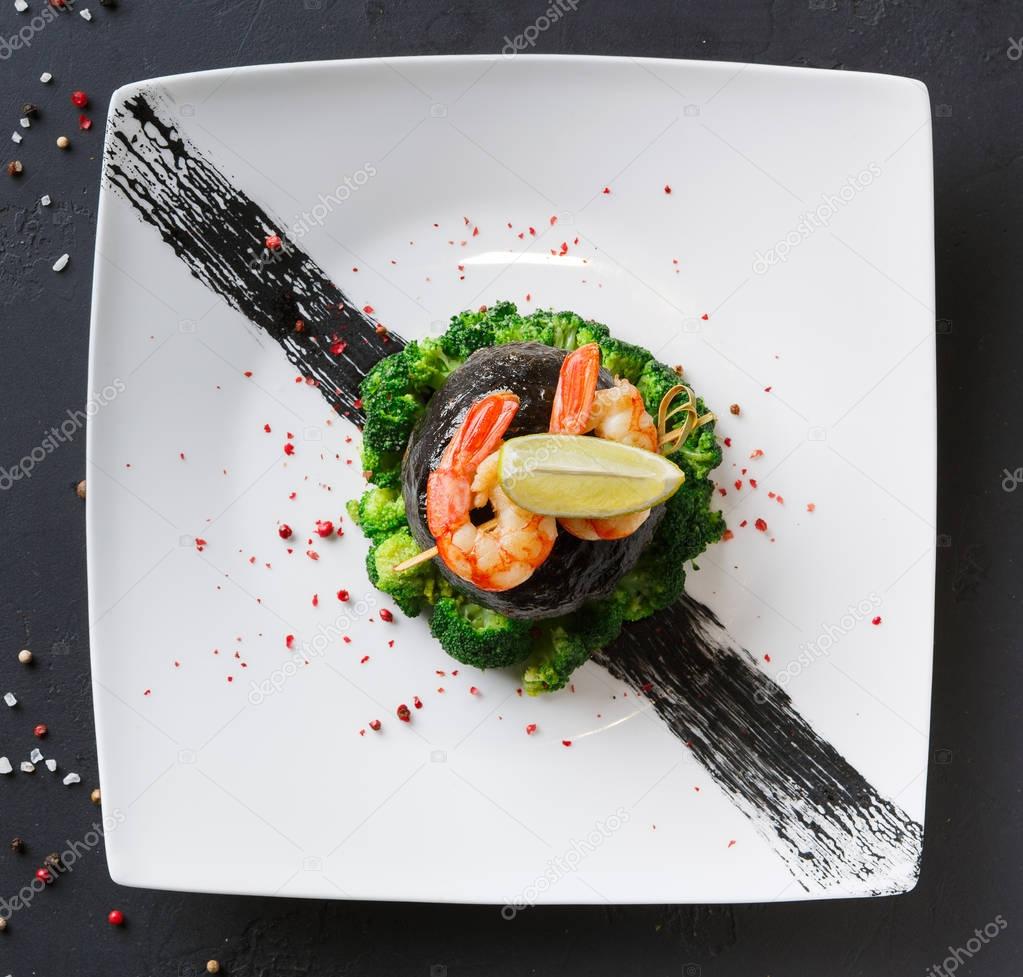 Modern restaurant food. Dorado fillet in nori with shrimps