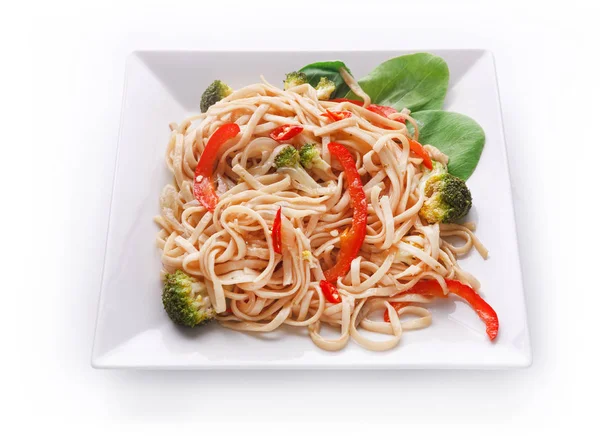 Vegetable stir fry with noodles in oriental style, isolated — Stock Photo, Image