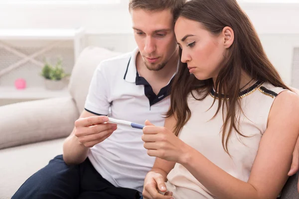 Sad couple after pregnancy test result copy space — Stock Photo, Image