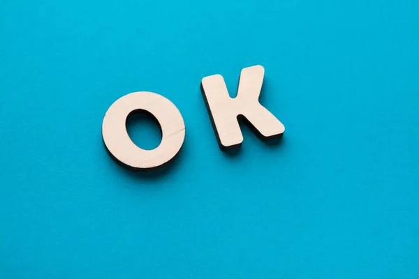 Word OK on blue background — Stock Photo, Image