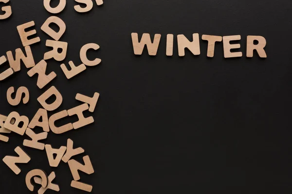 Word Winter with heap of wooden letters — Stock Photo, Image