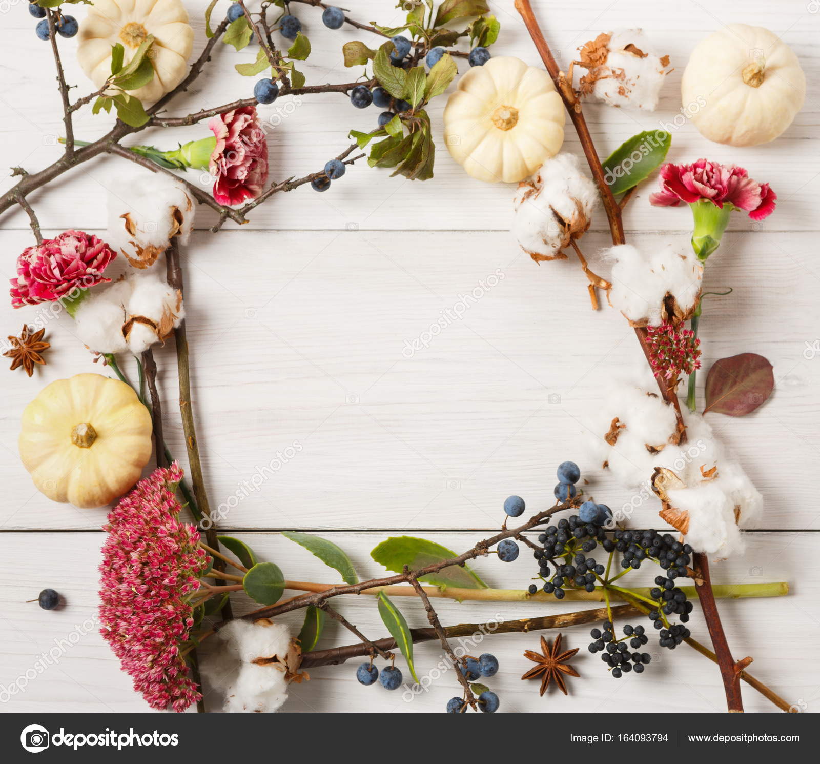 Autumn frame of dried flowers on white wood background — Stock Photo
