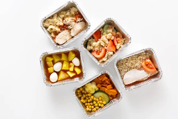 Healthy food take away in boxes on white background