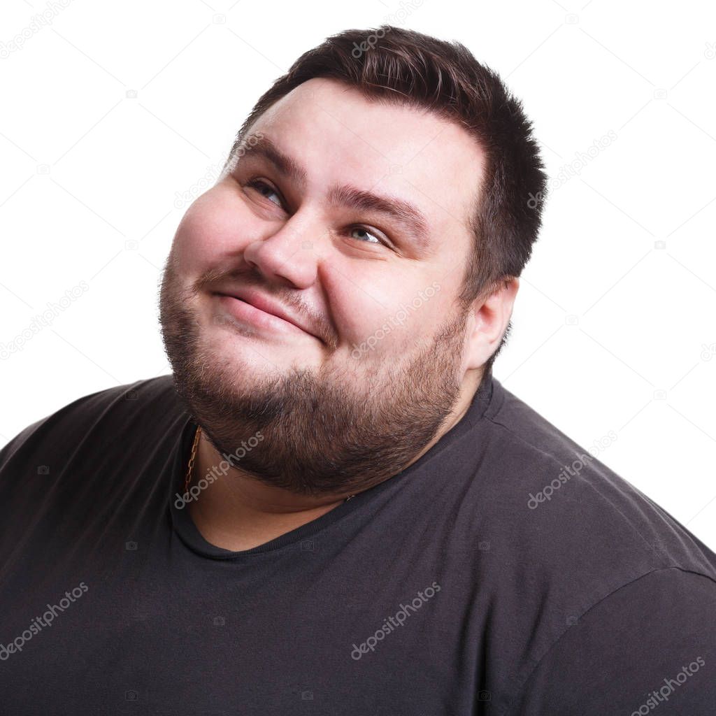 Lost in thoughts, smiling fat man with thoughtful face