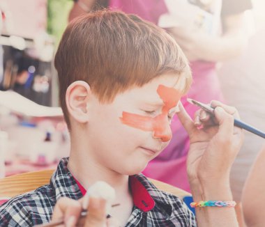 Çocuk çocuk yüz boyama, Kaplan gözü işlem yapma