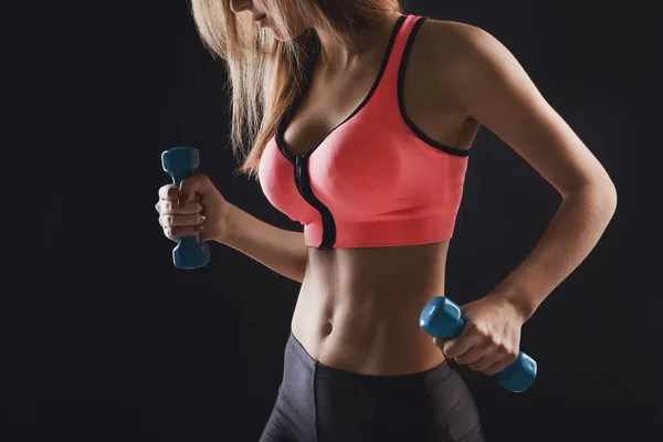 Fitness model woman with dumbbells at studio — Stock Photo, Image