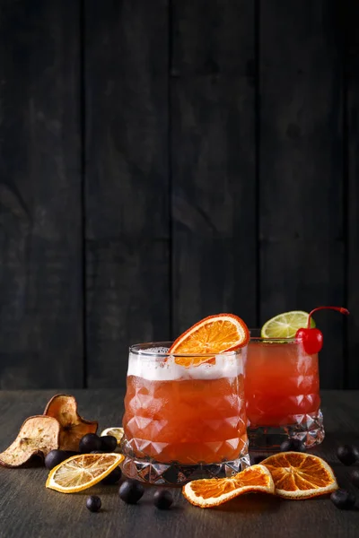 Orange cocktail with citron on wooden background — Stock Photo, Image