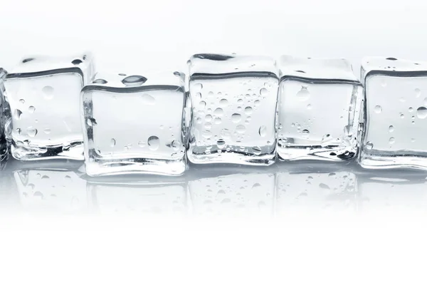 Transparent isbitar med vatten droppar isolerade på vit bakgrund — Stockfoto