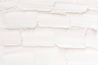 Beyaz tuğla duvar, sıva desen dokulu