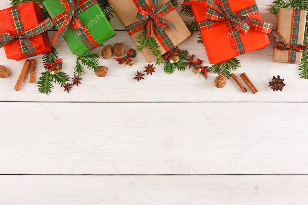 Colorful present boxes for any holiday on wooden background