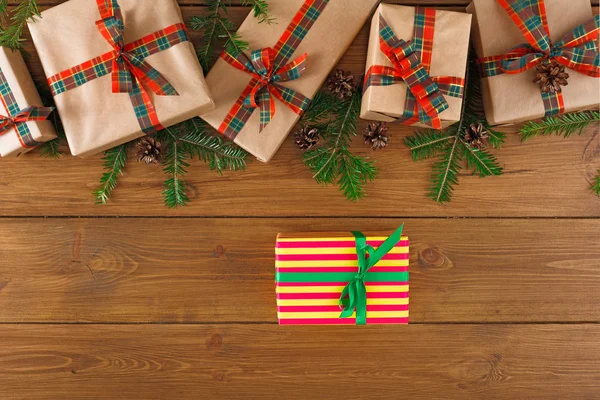 Colorful present boxes for any holiday on wooden background — Stock Photo, Image