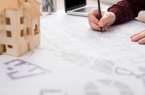 Architect working on blueprint in office — Stock Photo, Image