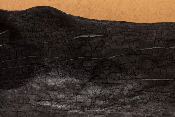 Verbranntes Holz schwarzer Hintergrund — Stockfoto