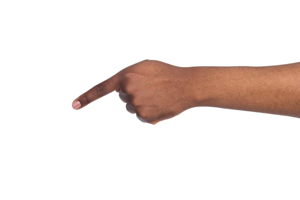 Palm of black man index finger muestra hacia adelante y hacia abajo sobre fondo blanco aislado —  Fotos de Stock