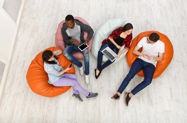 Diverse people using gadgets, top view — Stock Photo, Image