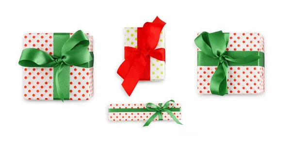 Gift box wrapped in white paper and bright ribbon — Stock Photo, Image