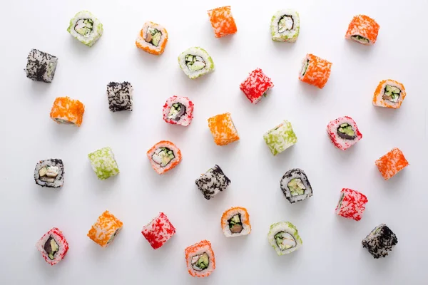 Top view on japanese sushi rolls, maki pattern on white background — Stock Photo, Image
