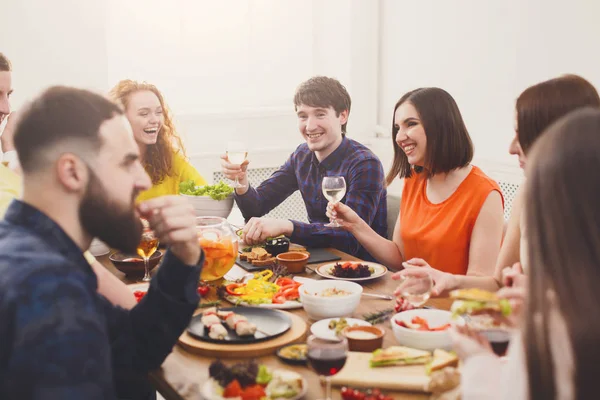 Group of happy people at festive table dinner party. Pretty girls talking. — Stock Photo, Image