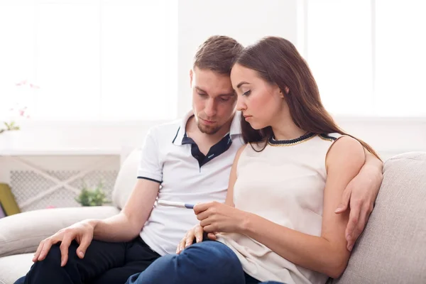 Sad couple after pregnancy test result copy space — Stock Photo, Image