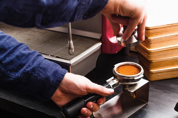 Closeup of barmen hand brewing espresso in professional coffee machine — Stock Photo, Image