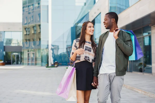 Multiracial couple shopping together