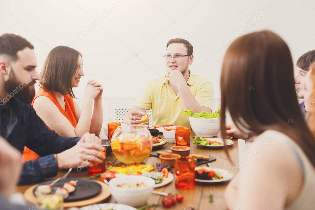 Firendly conversation at festive dinner table