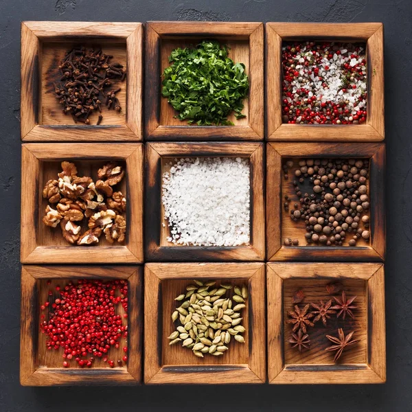 Diverse spices in a wooden box closeup — Stock Photo, Image