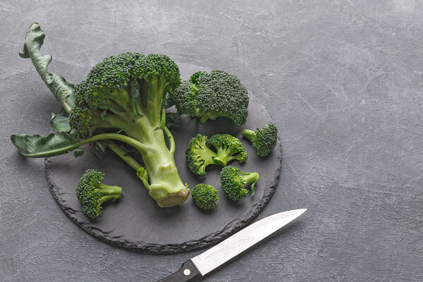 Rustic slate stone plate with broccoli, copy space, cooking backgroung.