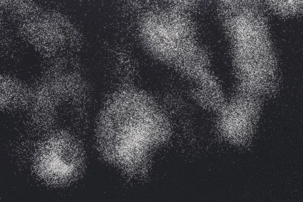 Macchie spruzzate di farina di grano su sfondo nero — Foto Stock