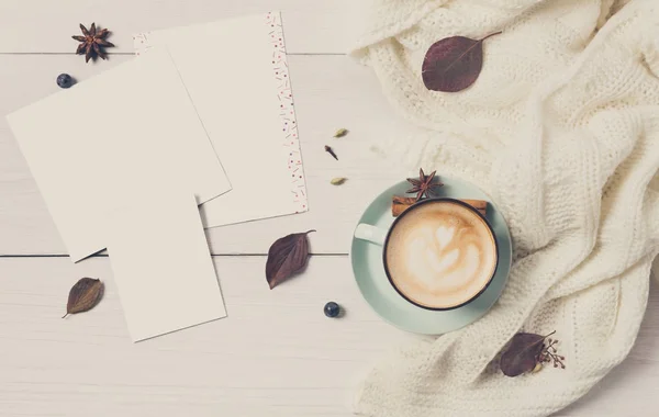 Autumn cappuccino coffee cup on white wood background — Stock Photo, Image