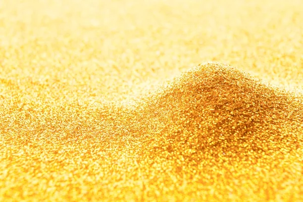 Golden glitter pile, bright luxury background — Stock Photo, Image