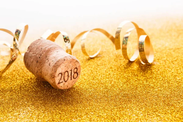 Champagne cork with 2018 stamp and serpentine