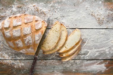 Fırın kavramı arka plan. Beyaz dilimlenmiş ekmek ve bıçak