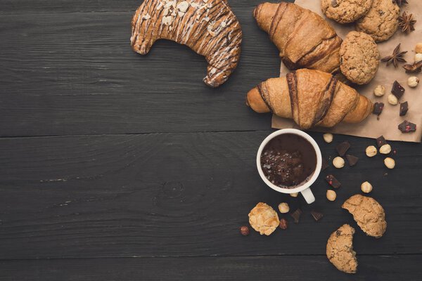 Freshly baked croissants and coffee background