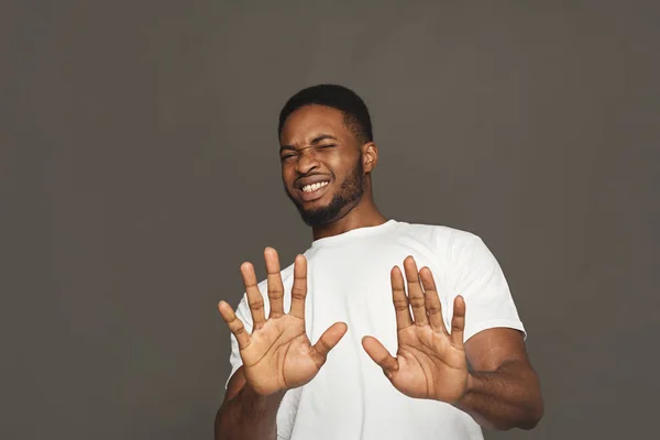 Negative human emotion, black man expressing disgust — Stock Photo, Image