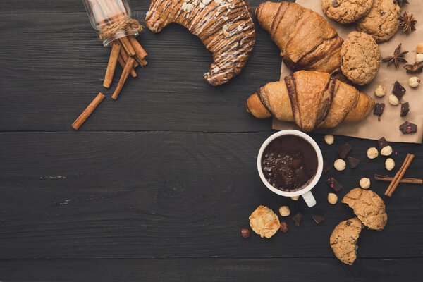 Freshly baked croissants and coffee background