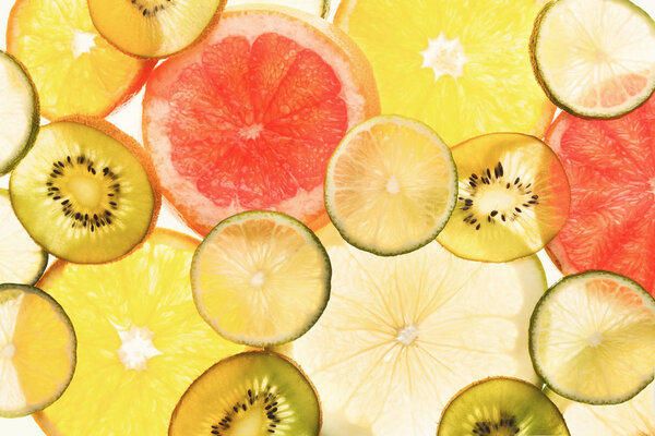 Backlit citrus fruits slices background