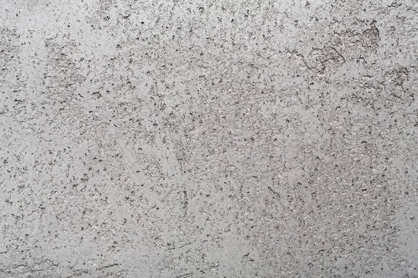 Текстурированная поверхность старой стены здания с пятнами — стоковое фото