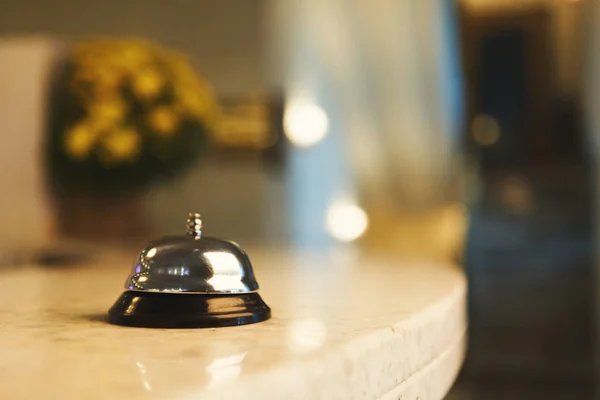 Hotel accommodation call bell on reception desk — Stock Photo, Image