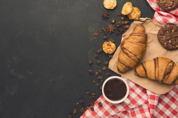 Freshly baked croissants and coffee background