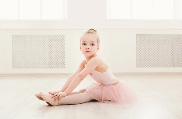 Portrait of little ballerina on floor, copy space — Stock Photo, Image