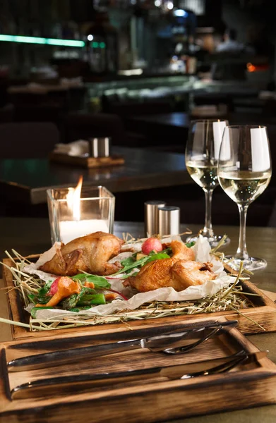 Dinner for two. Quails baked with asparagus and chanterelles — Stock Photo, Image