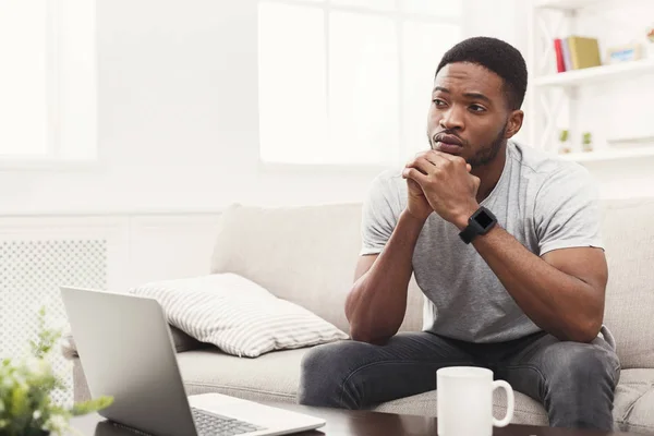 Thoughtful young african-american man at home — Stock Photo, Image