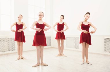 Young girls dancing ballet in studio clipart
