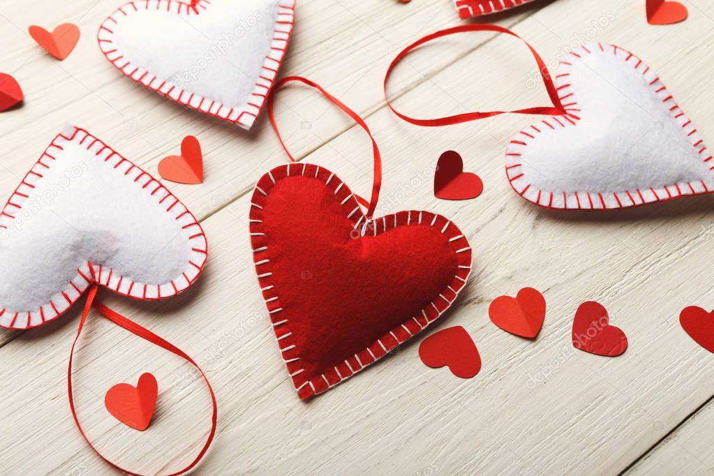 Valentine day background, handmade pillow hearts on wood, copy space