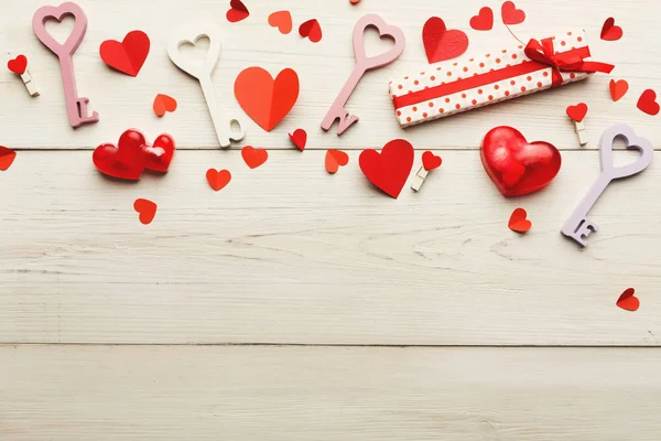 Valentine day background, handmade hearts on wood with copy space